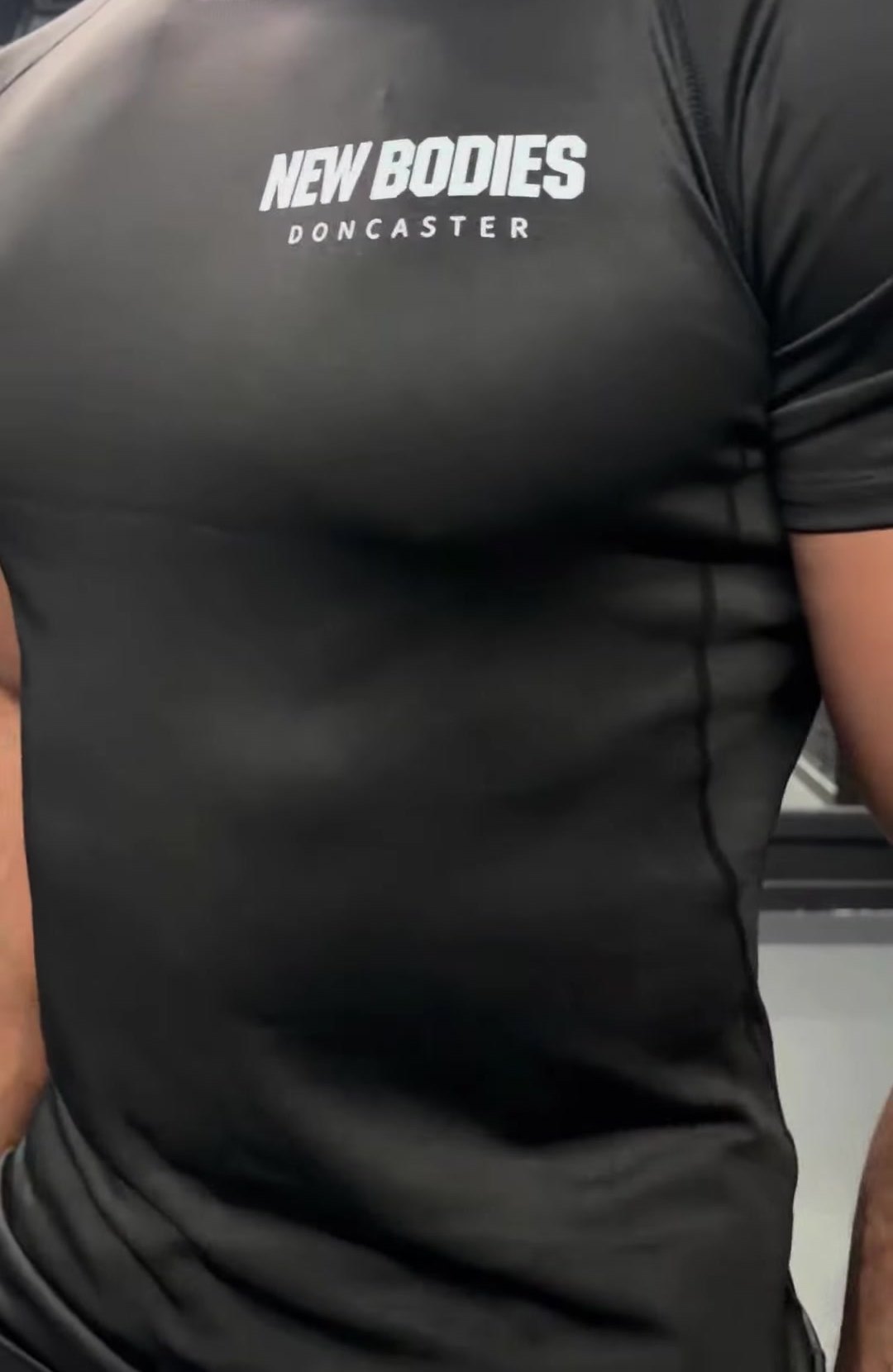 Black New Bodies Doncaster t-shirt print, close-up